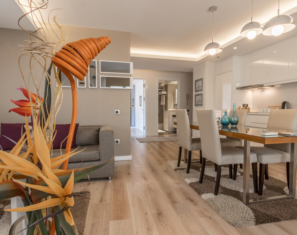 Furnished dining table and living area with a sofa