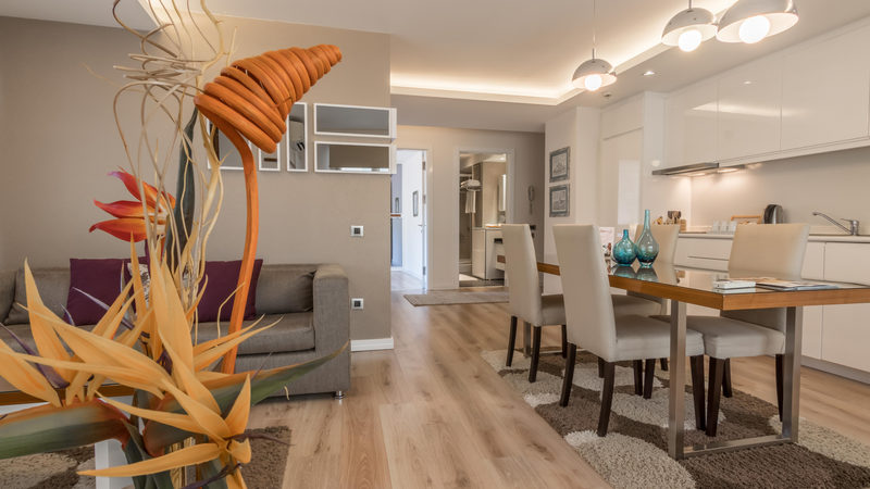 Furnished dining table and living area with a sofa