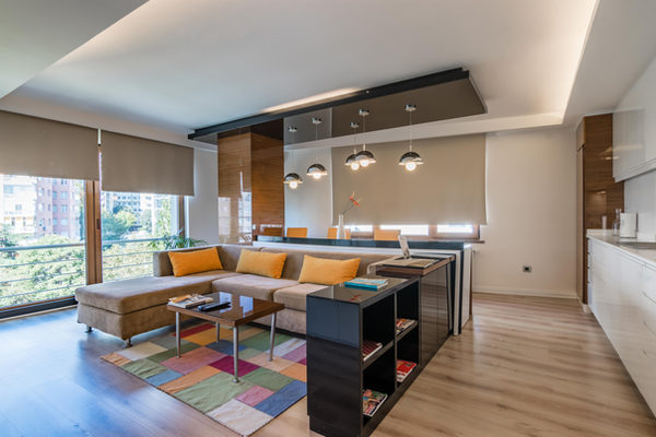 Living area with corner sofa and open kitchen
