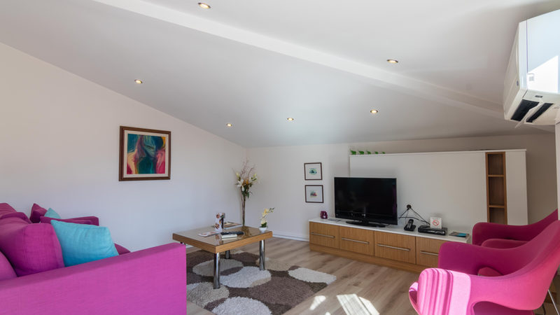 Apartment living room with a desk and seating area